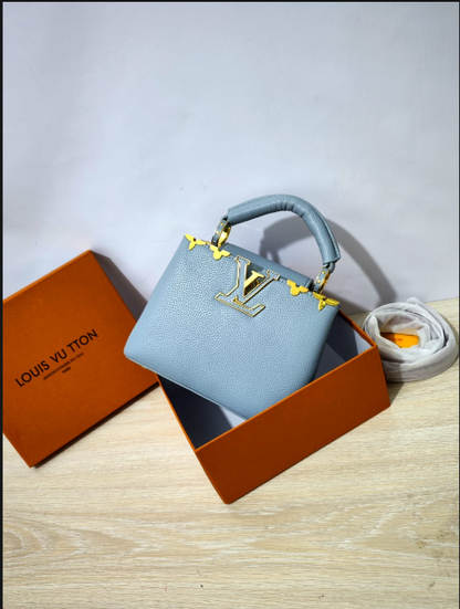Louis Vuitton Capucines Handbag with Gold-Tone LV Clasp